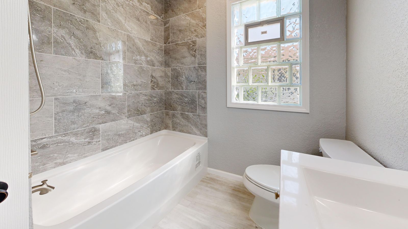 A shower you step into, not over. A Meridian Bath & Tile project in Denver.