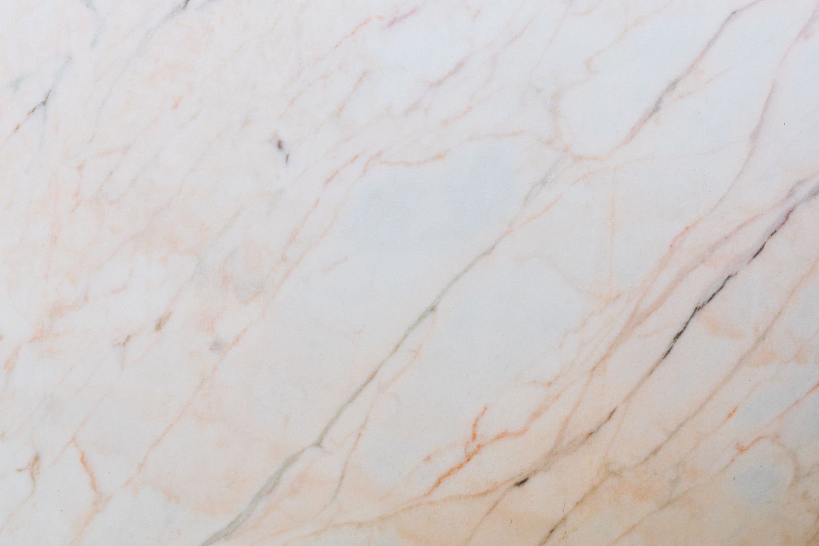 Soapstone surface. Talc-rich, darkens with oil, Mohs 2 to 3.
