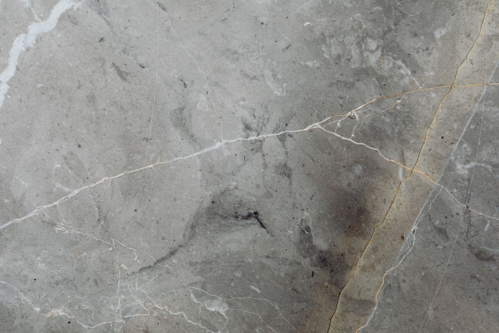 Porcelain, marble-look surface. Through-body porcelain, water absorption under 0.5%.
